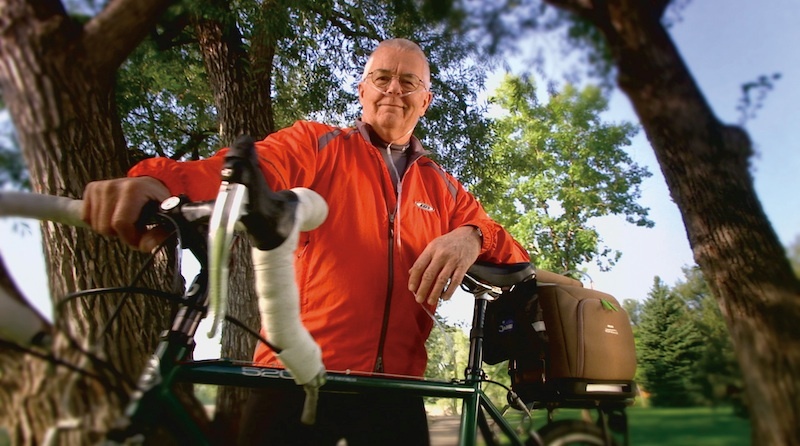 respironics-simplygo-portable-oxygen-concentrator-man-on-bike